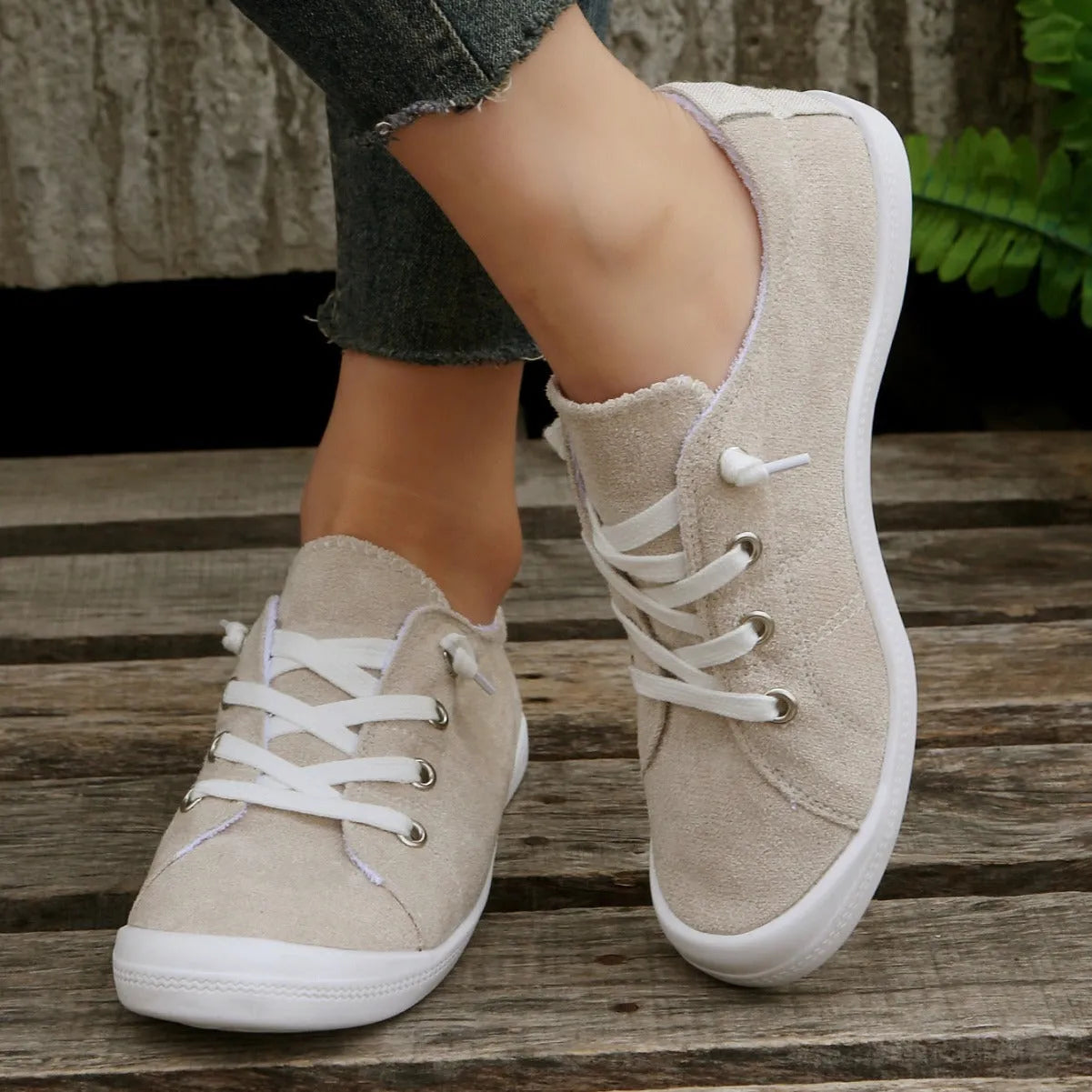 Women's creamy white low-top fabric casual sneaker on a wear-resistant rubber sole