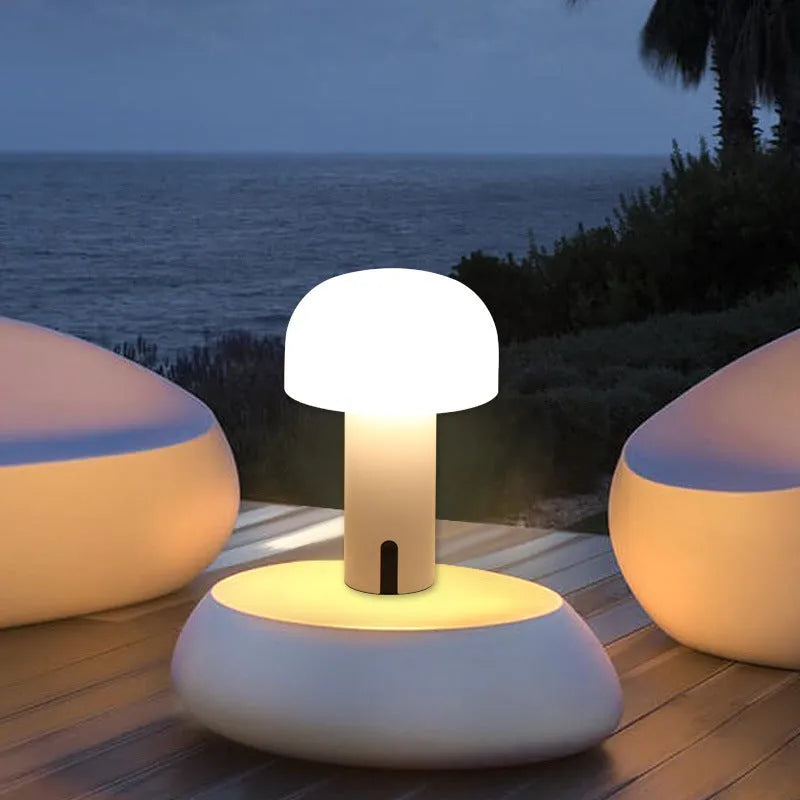 Decorative LED mushroom night light with touch switch in warm white, on a bedside table