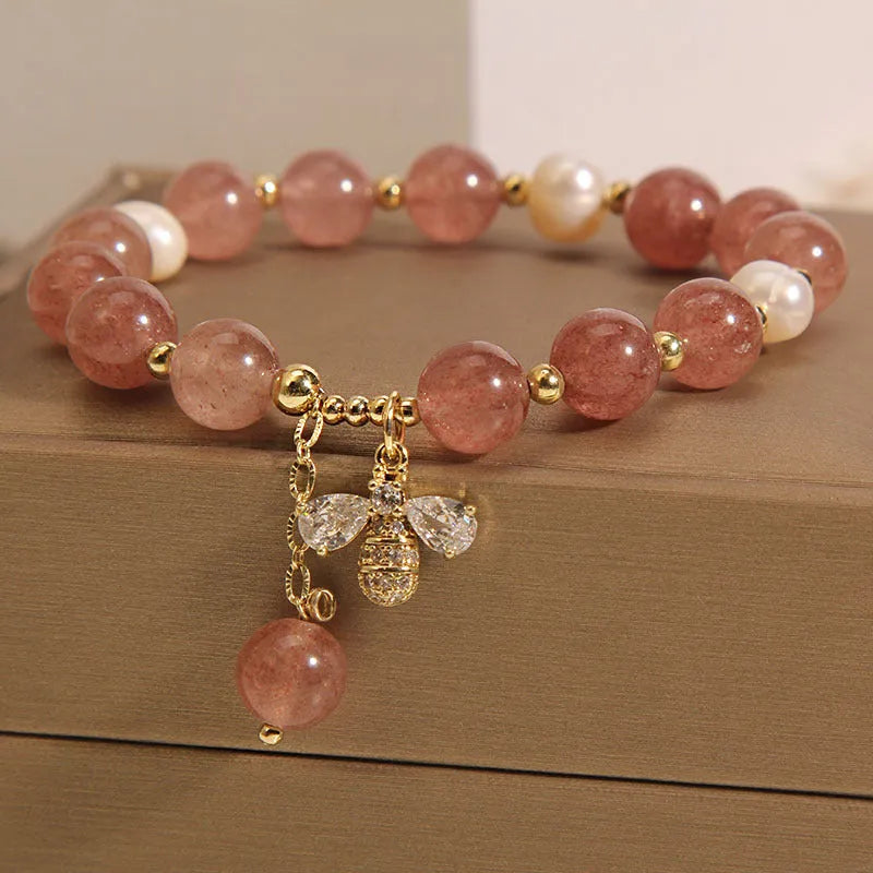 Women's strawberry quartz and freshwater pearl bracelet with zircon details and alloy charms