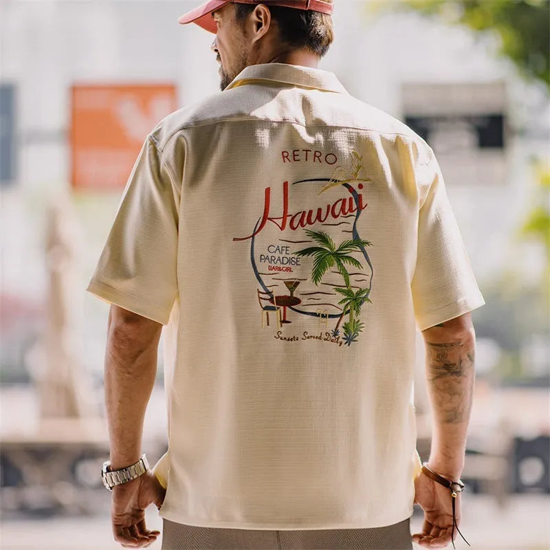 Light apricot men's Cuban collar shirt with bamboo plant pattern design