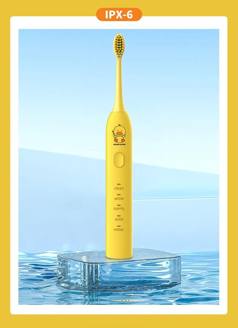 Yellow rechargeable electric toothbrush with small duck design, soft bristles, and a compact size.
