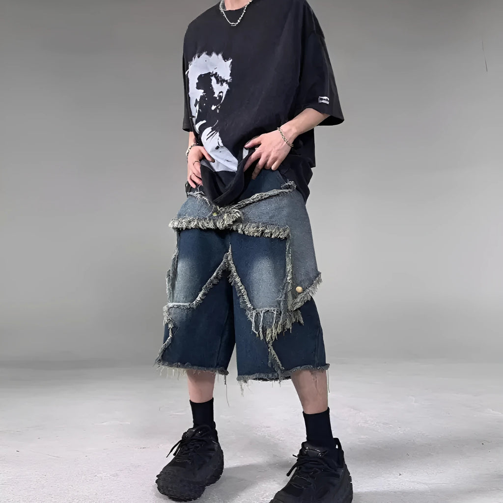 Blue cotton denim shorts for men with frayed hem detailing and five-pointed star patch, loose fit retro style