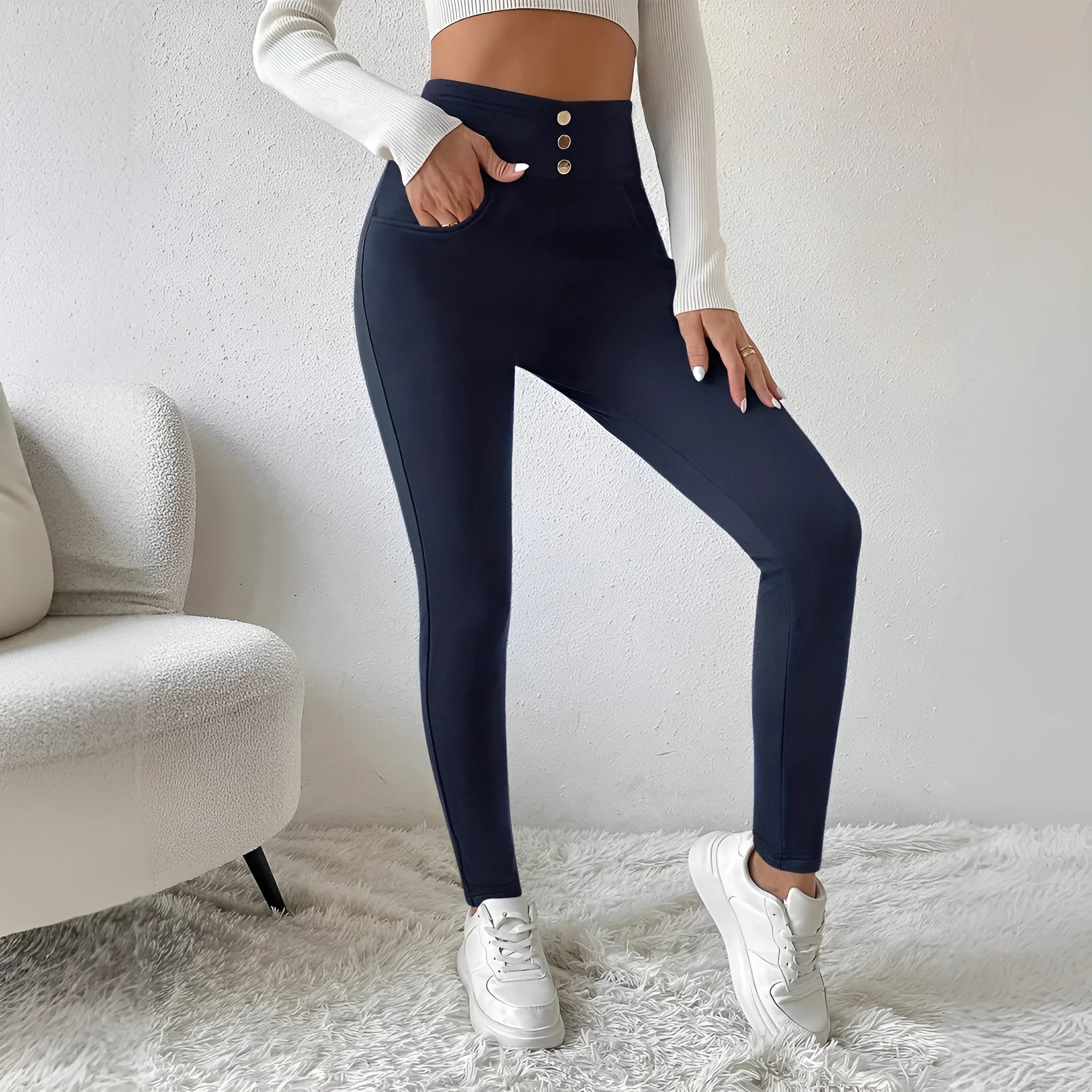Navy blue women's high-waisted straight leg trousers on a hanger, showing the front and side silhouette.