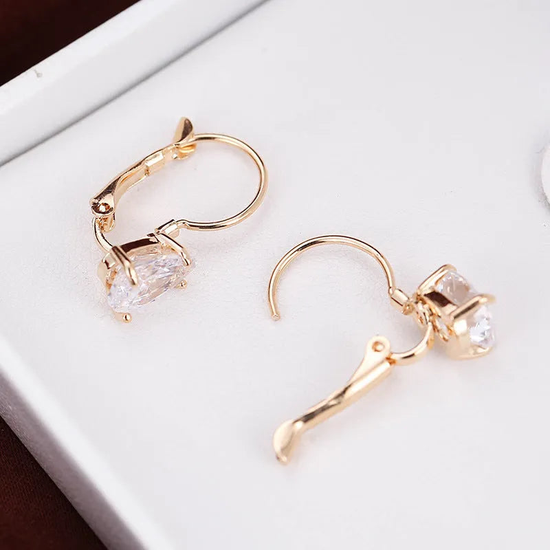 Copper drop-shaped fashion earrings with platinum plating and inlaid gem details.