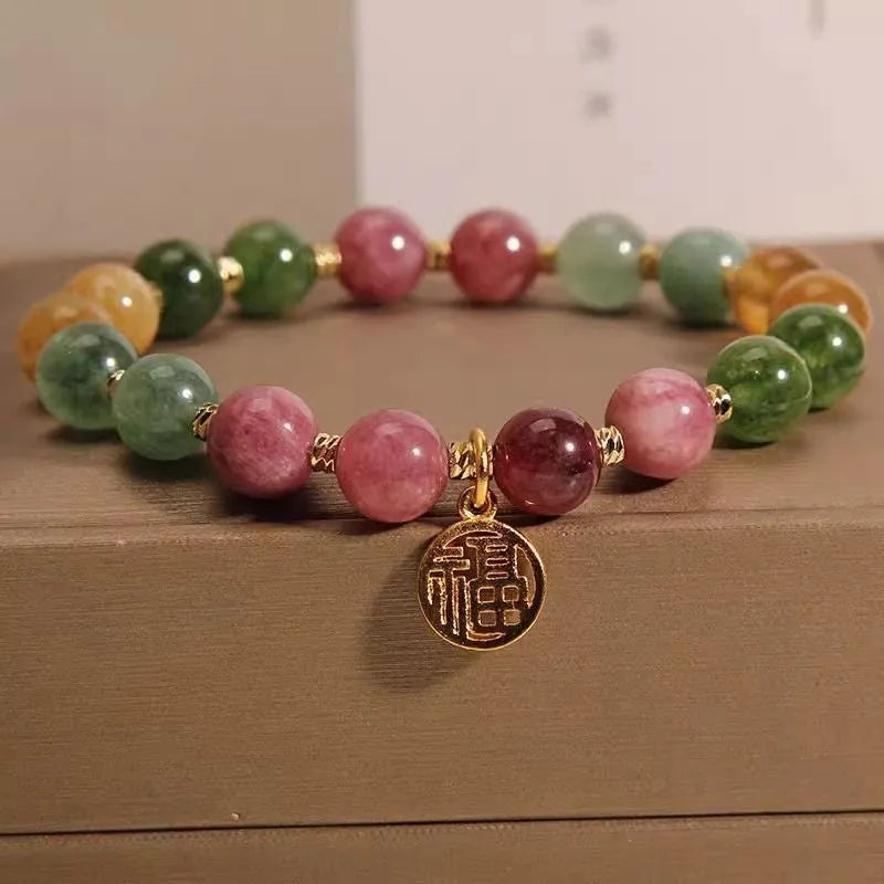 Natural colour tourmaline bracelet with geometric design showing floral or Chinese Fu character options