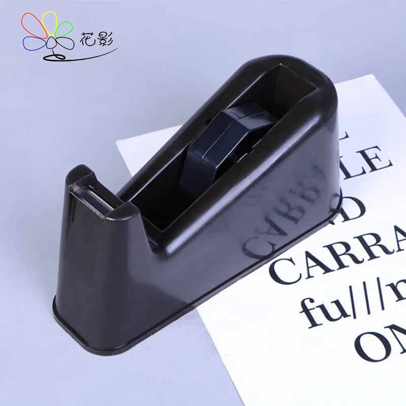 Dual-purpose tape cutter with PS body and stainless steel blade on a desk