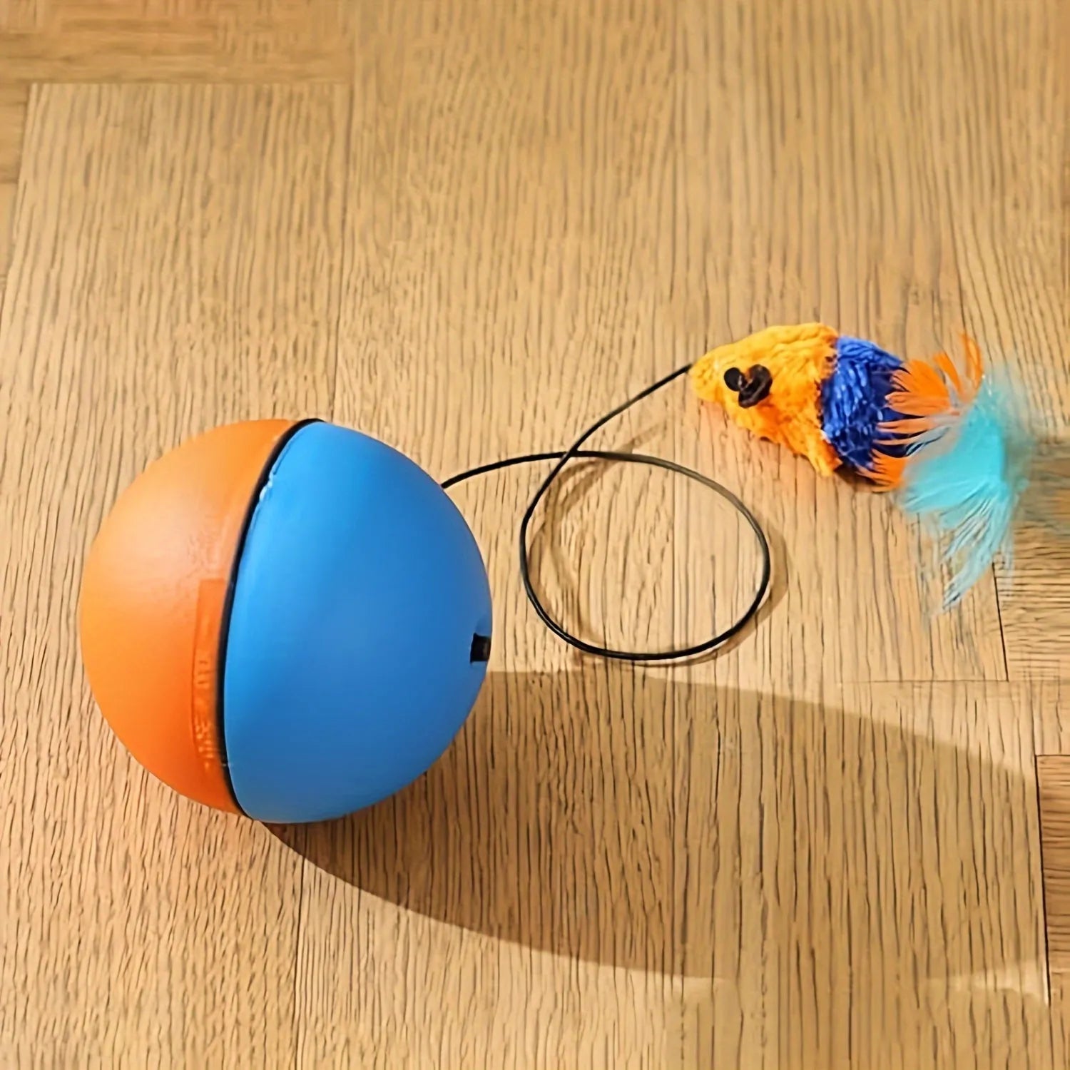 Interactive cat toy with grey and orange plush mouse, ball, and feather tail for feline exercise