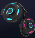 Black and white wireless Bluetooth earphones with hanging ear design and USB charging