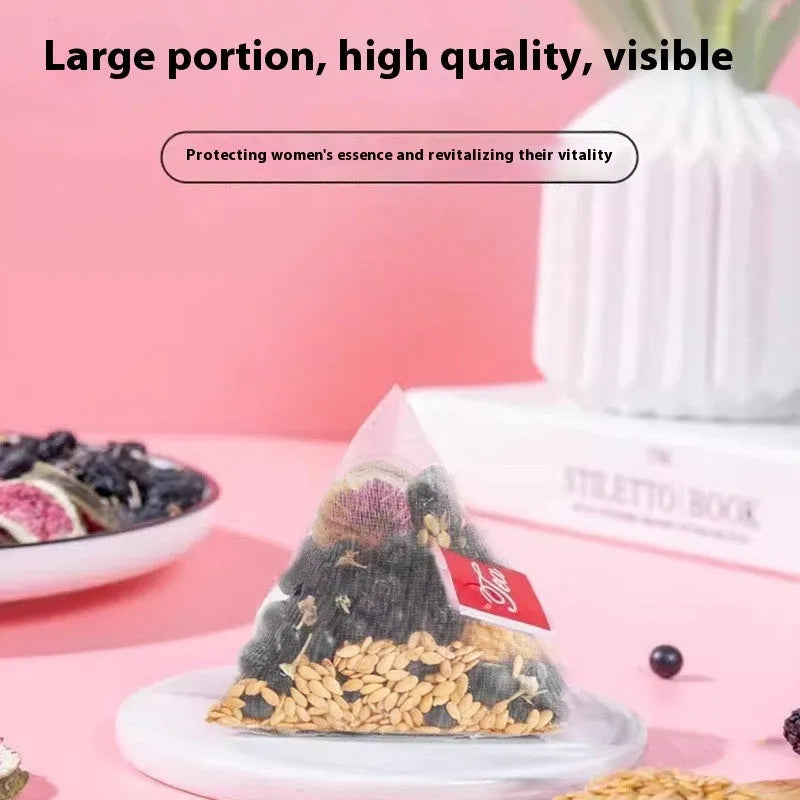 Packets of Black Wolfberry Mulberry Tea blend with flaxseed and fig for women's health care.
