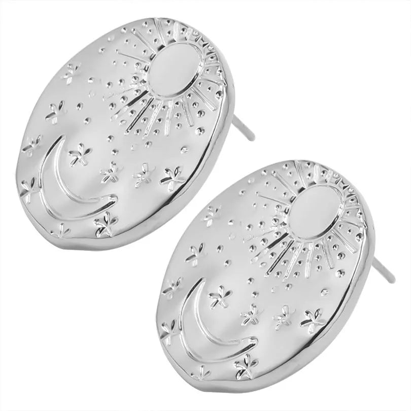 A pair of geometric shell design stud earrings in stainless steel with a gold or silver finish.