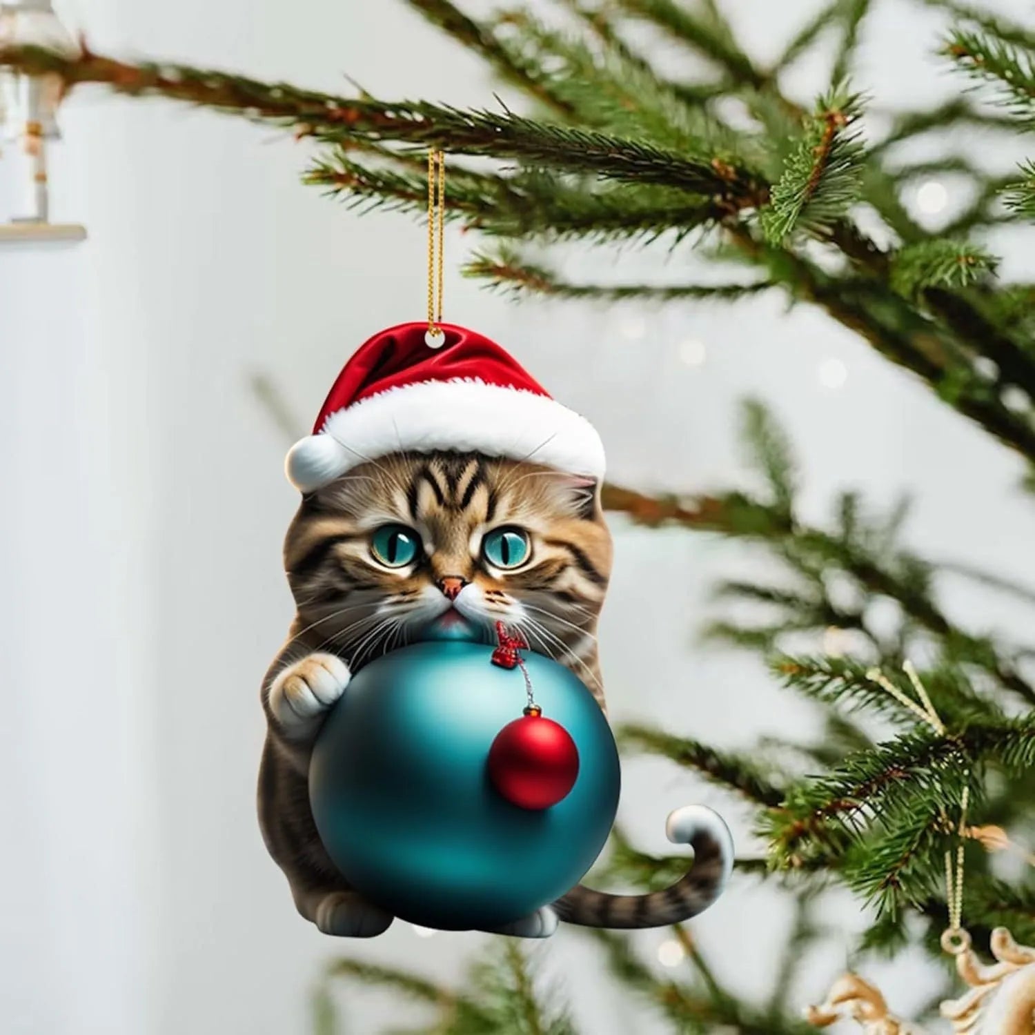 Cartoon style creative kitty Christmas ornament hanging in a car, made from clear acrylic.