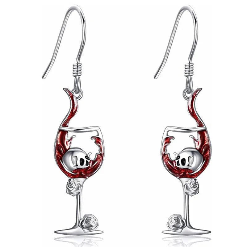 A pair of geometric skull wine glass shaped earrings with an electroplated finish.