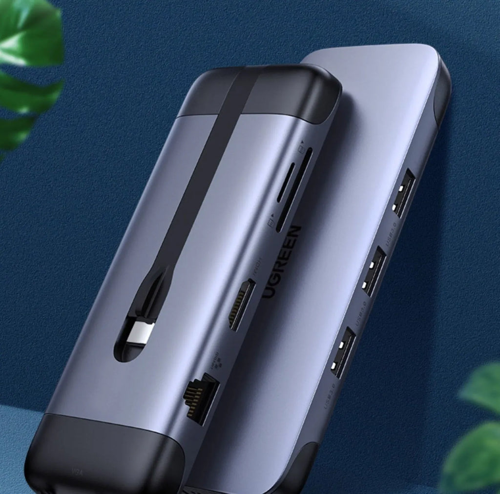 USB-C to multi-port dock expansion adapter showing HDMI, USB 3.0, PD charging, VGA, and Ethernet ports.