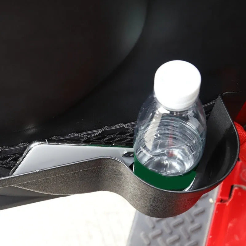 Black aluminium alloy car interior storage box with a net pocket for organising sunglasses and phones.