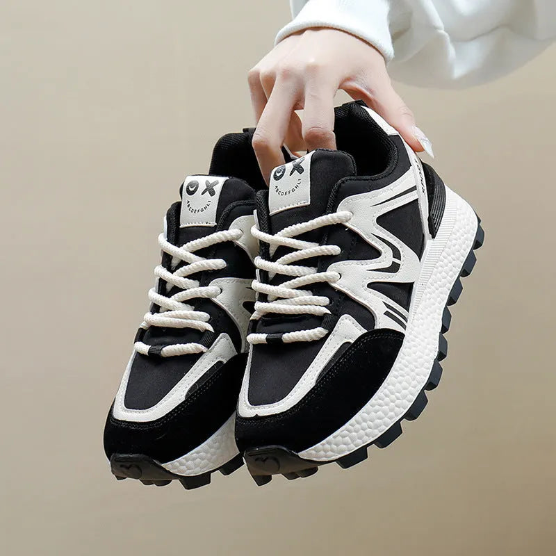 Women's black platform casual trainers with round toe and lace-up front on a white background.