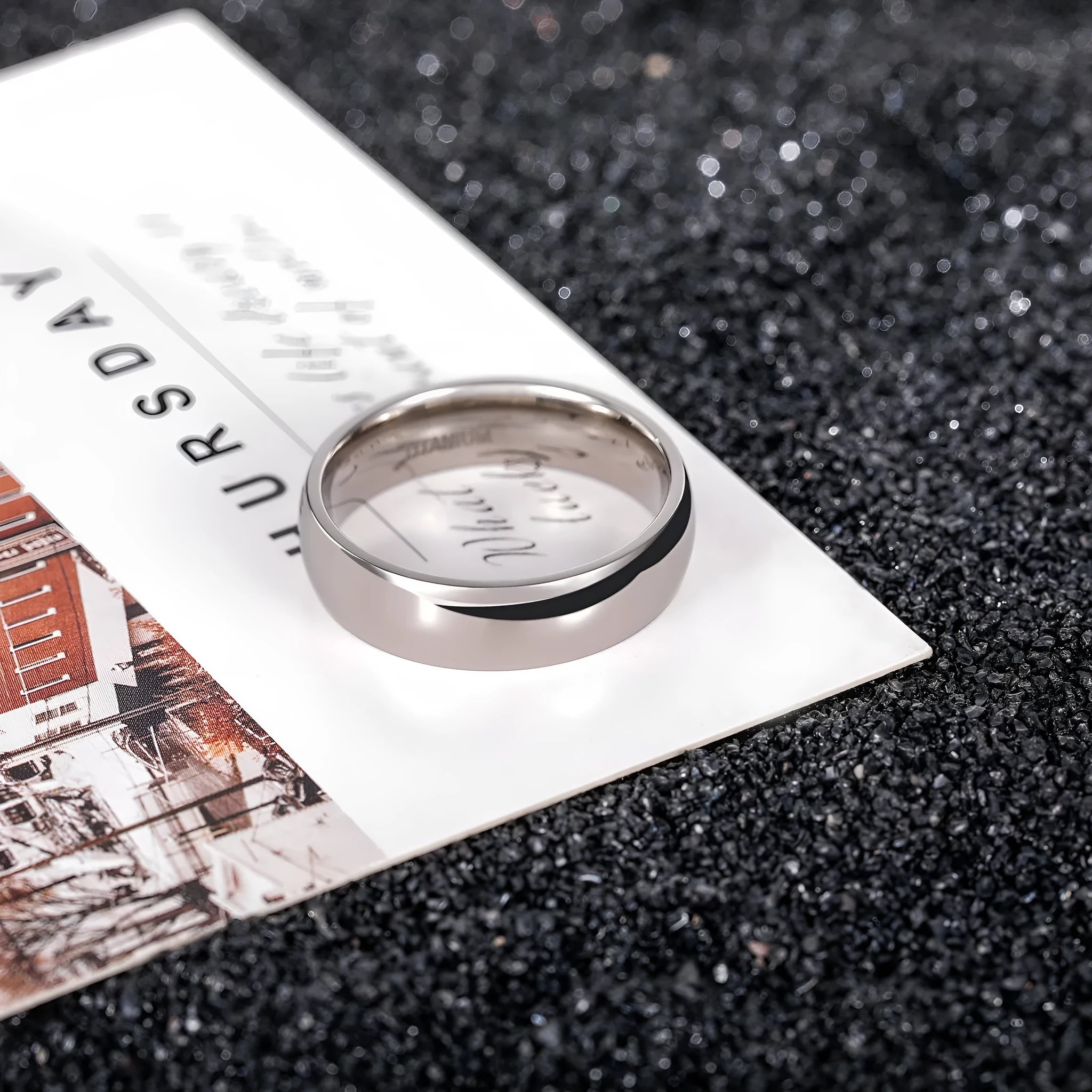 A simple matte silver titanium ring shown in three width options: 2mm, 4mm, and 6mm.