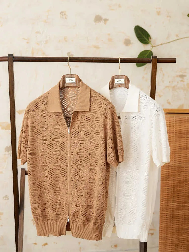 Men's light brown short sleeve cotton cardigan with zip front and lapel collar laid flat.