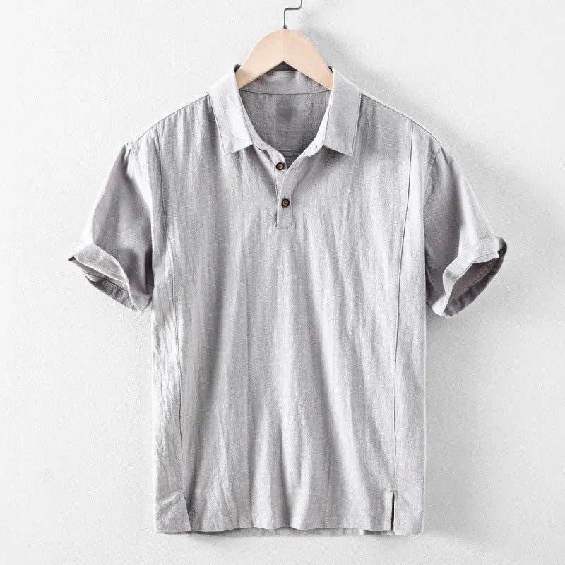 Man wearing a loose-fit light grey linen casual shirt for leisure.
