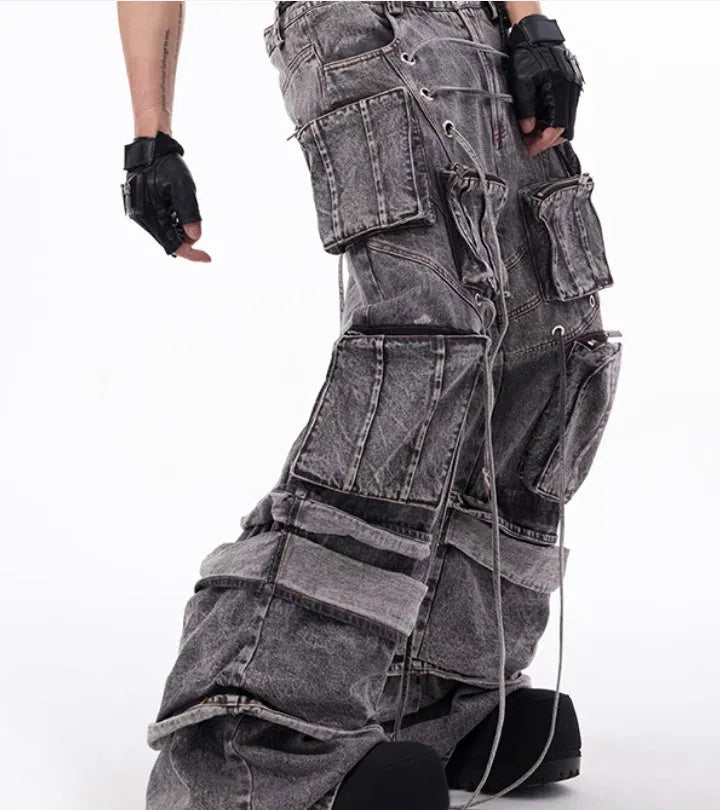 Grey American-style distressed denim overalls with rope stitching on cotton fabric.