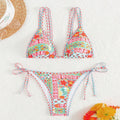 Women's lace-up front split-leg swimsuit in picture colour with brief style bottoms