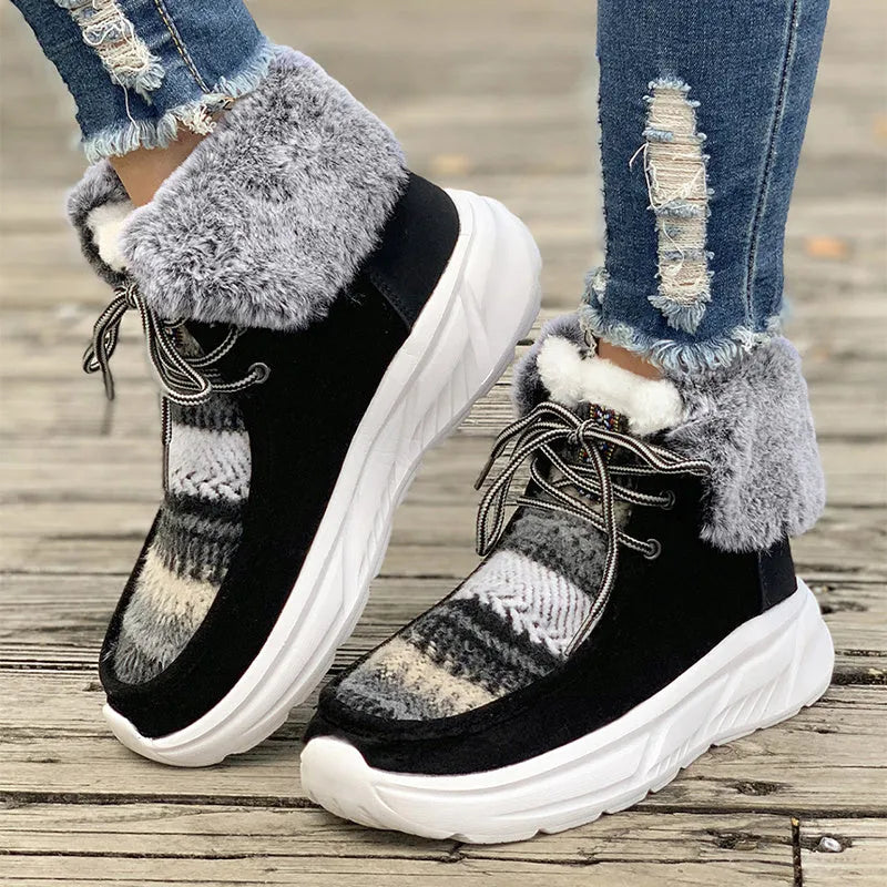 Beige women's lace-up mid-top snow boots with fuzzy lining and a thick rubber sole.