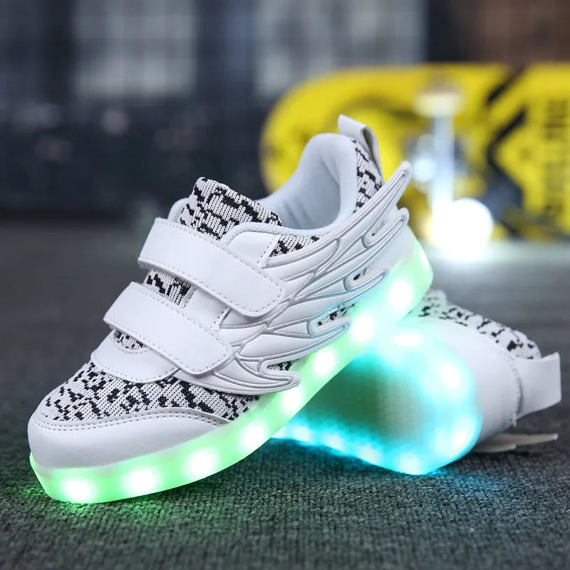 Plum red children's sneakers with illuminated LED soles and a USB charging cable.
