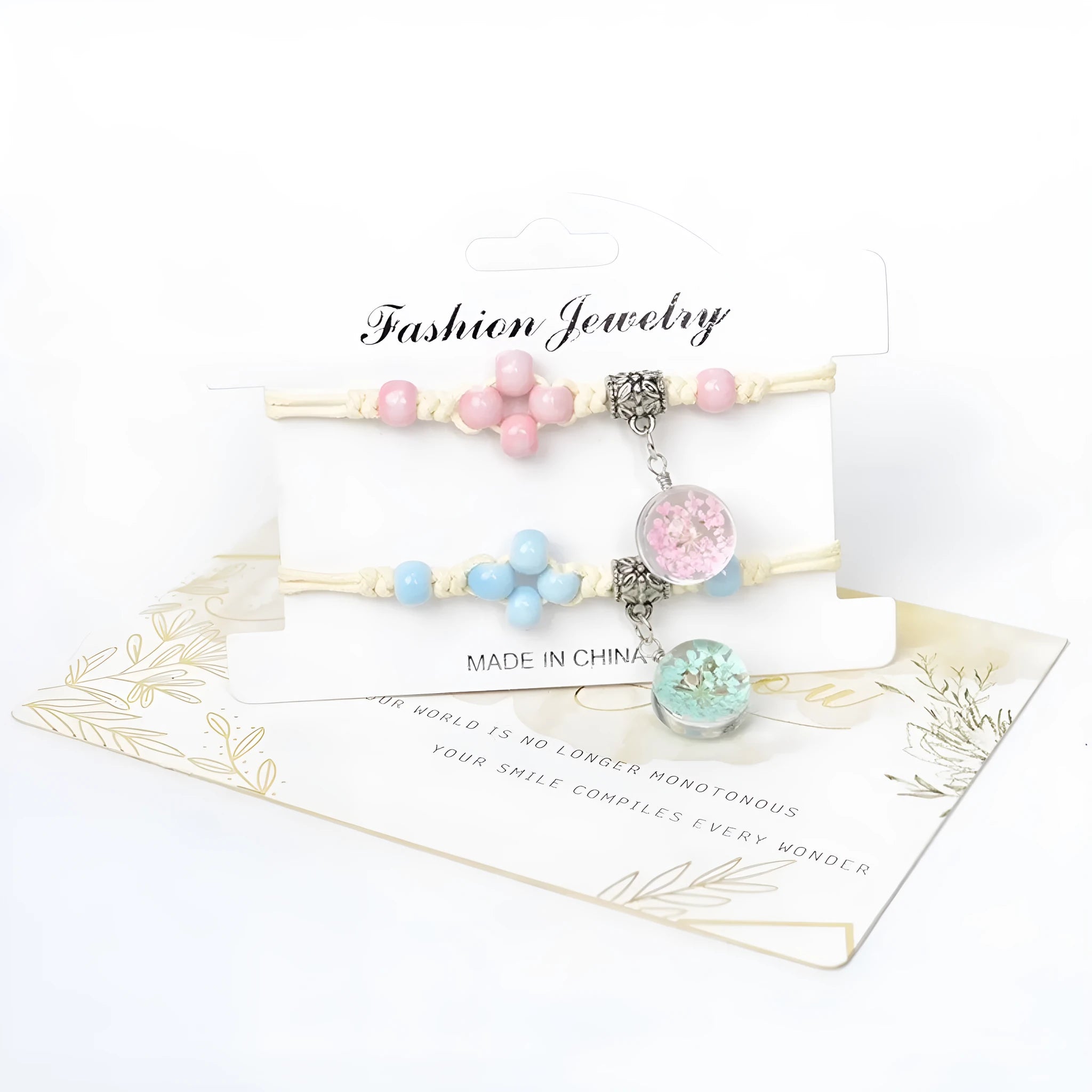 Women's glass bracelet with large beads containing real dried flowers, shown in blue colour.