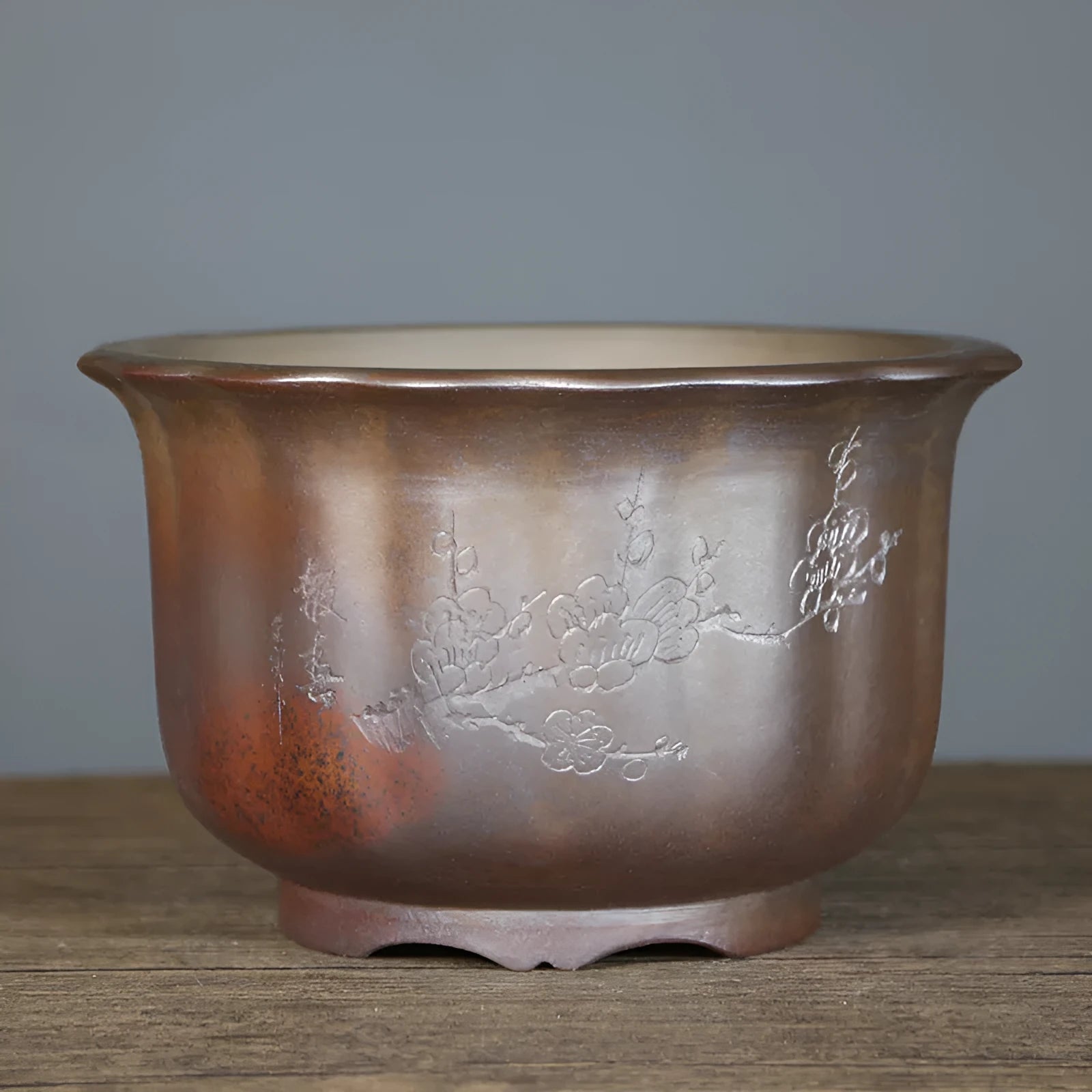 Indoor antique carved purple sand ceramic bonsai pot in classical style with wood burning finish.