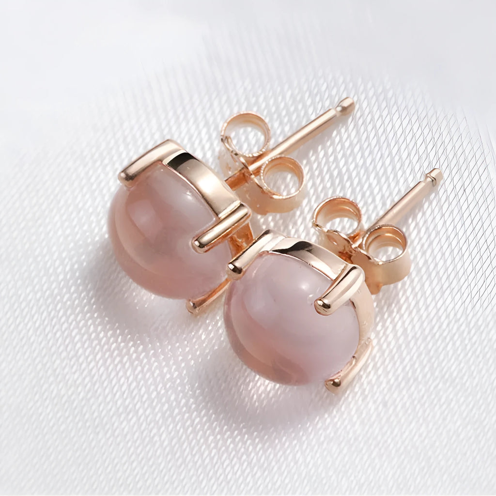 Women's rose gold Korean style drop shaped stud earrings with synthetic ross quartz crystal inlay