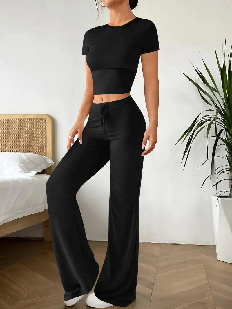 Black women's co-ord set with high waist trousers and a regular sleeve t-shirt