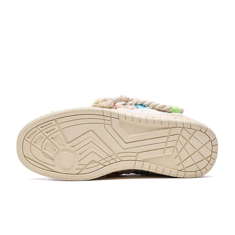 Creamy white low-top retro skate shoes with platform heel and lace-up design on a plain background.