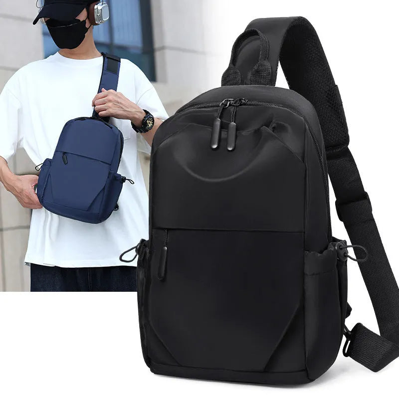 Men's grey waterproof chest bag with adjustable shoulder strap showing front compartment