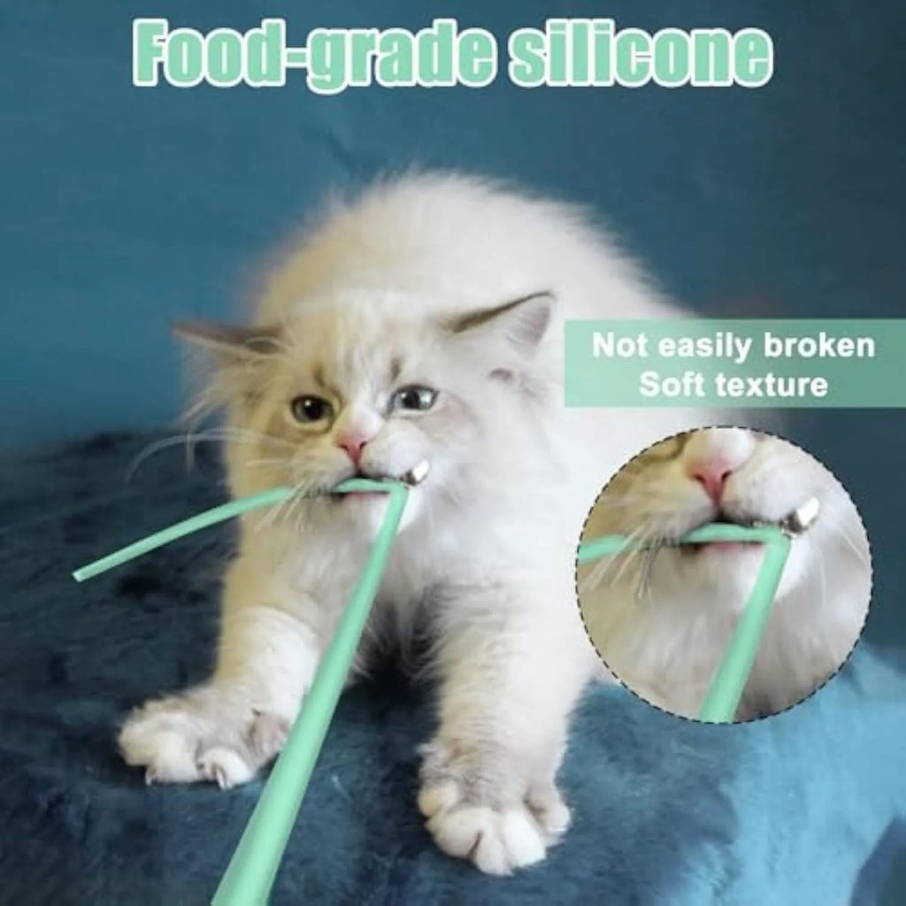 Green automatic cat wand toy with swinging silicone tail on floor for indoor cat play