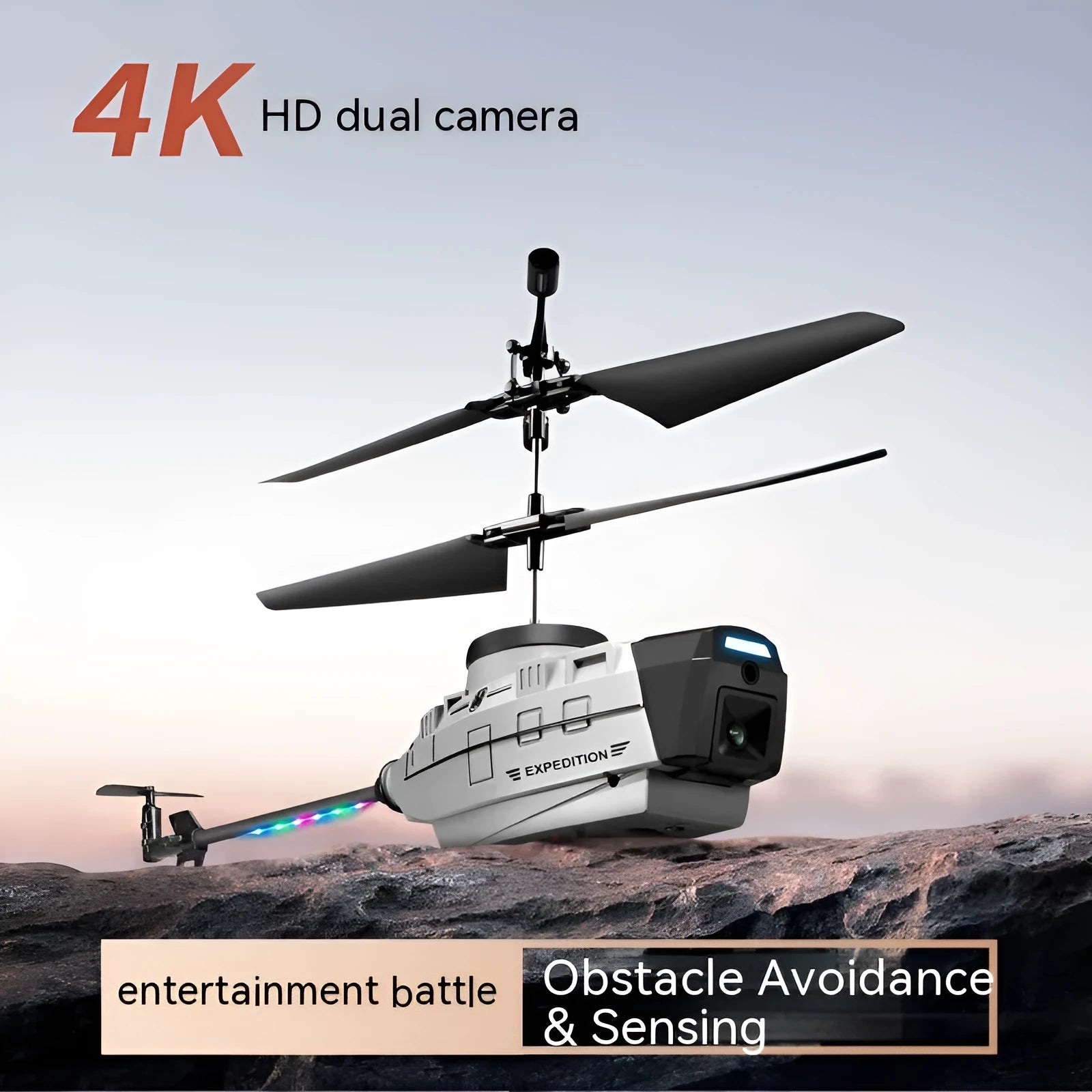 Heifeng grey plastic RC reconnaissance helicopter toy with coloured lights, remote control and accessories on a table.