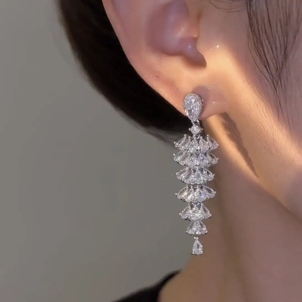 Silver pagoda Christmas tree drop earrings with sparkling zircon detail on copper studs.