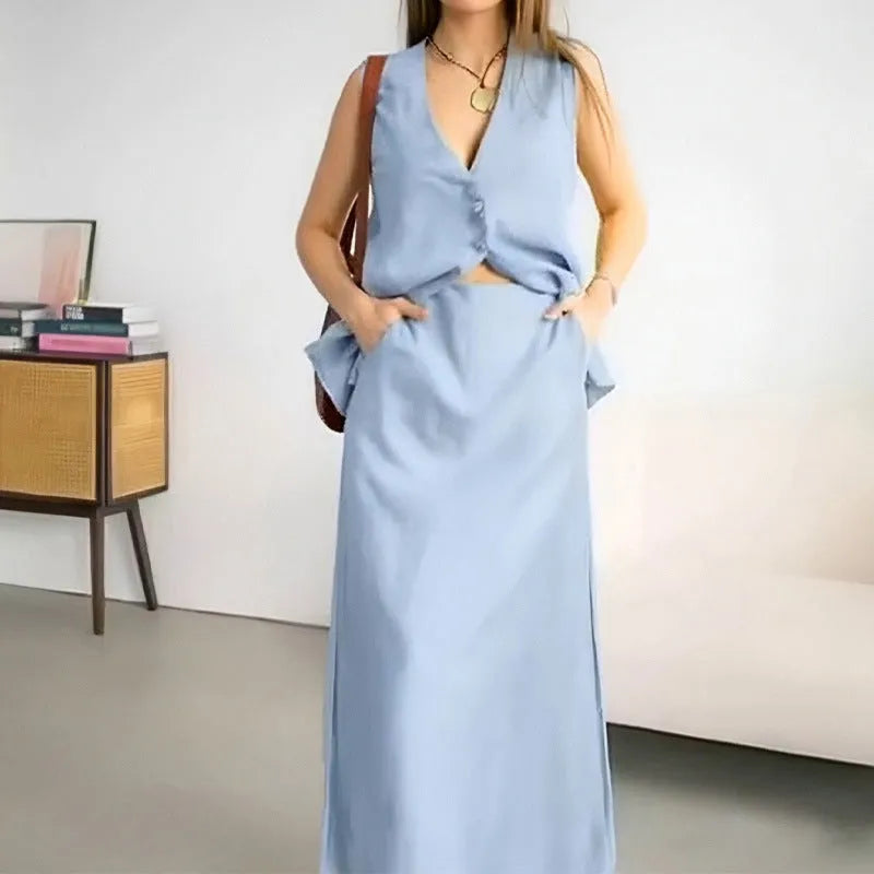 Women's casual two-piece outfit with a sleeveless loose vest and a long flowing skirt on a hanger.