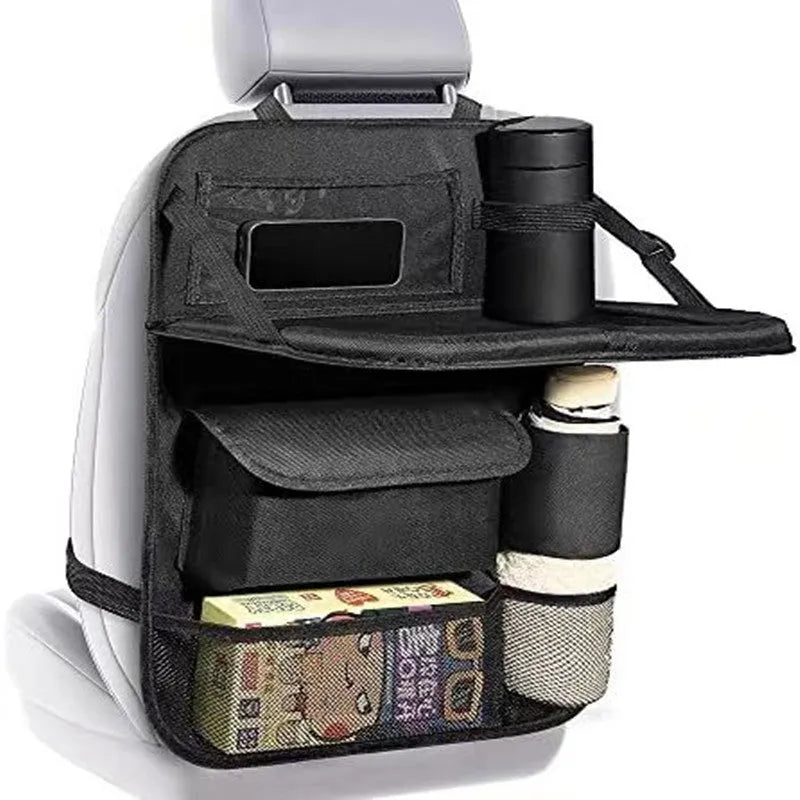 Black Oxford cloth car seat back storage bag hanging behind vehicle seat