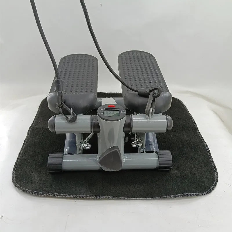 Silver grey mini treadmill waist slimming machine with hydraulic resistance and pedals.