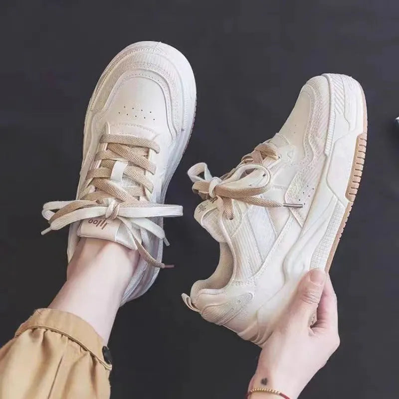 Women's pink and white low-top sneakers with a rubber sole, shown in sizes 35 to 40.