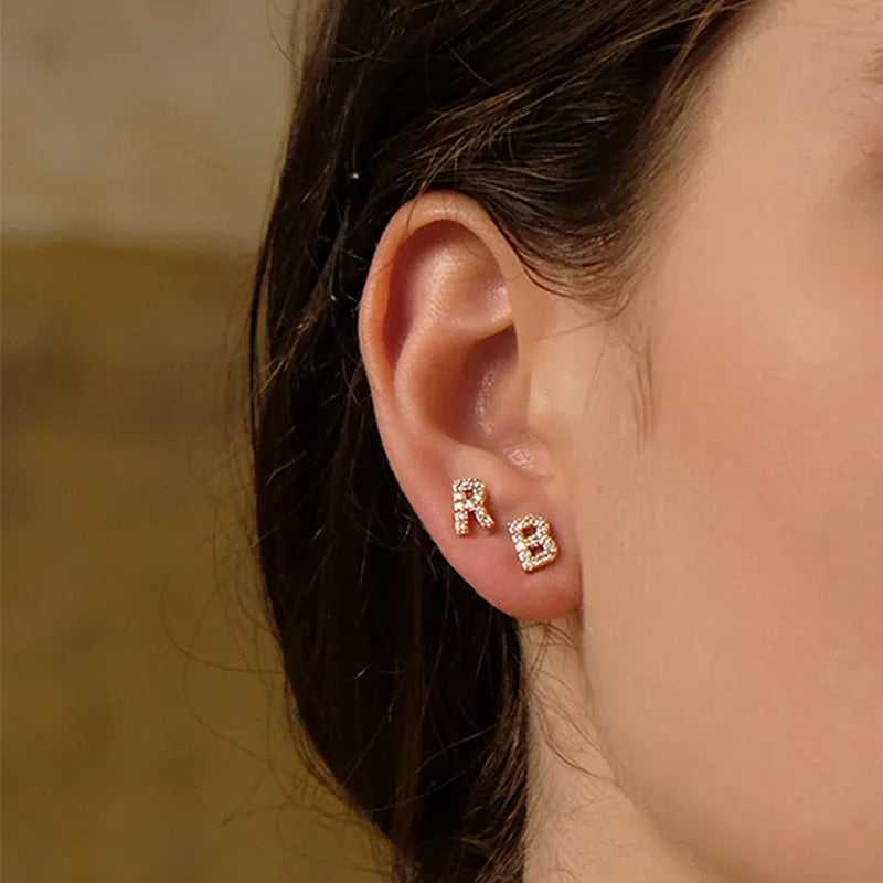 Gold plated alphabet letter earrings showing all 26 English letters A to Z with zircon detailing