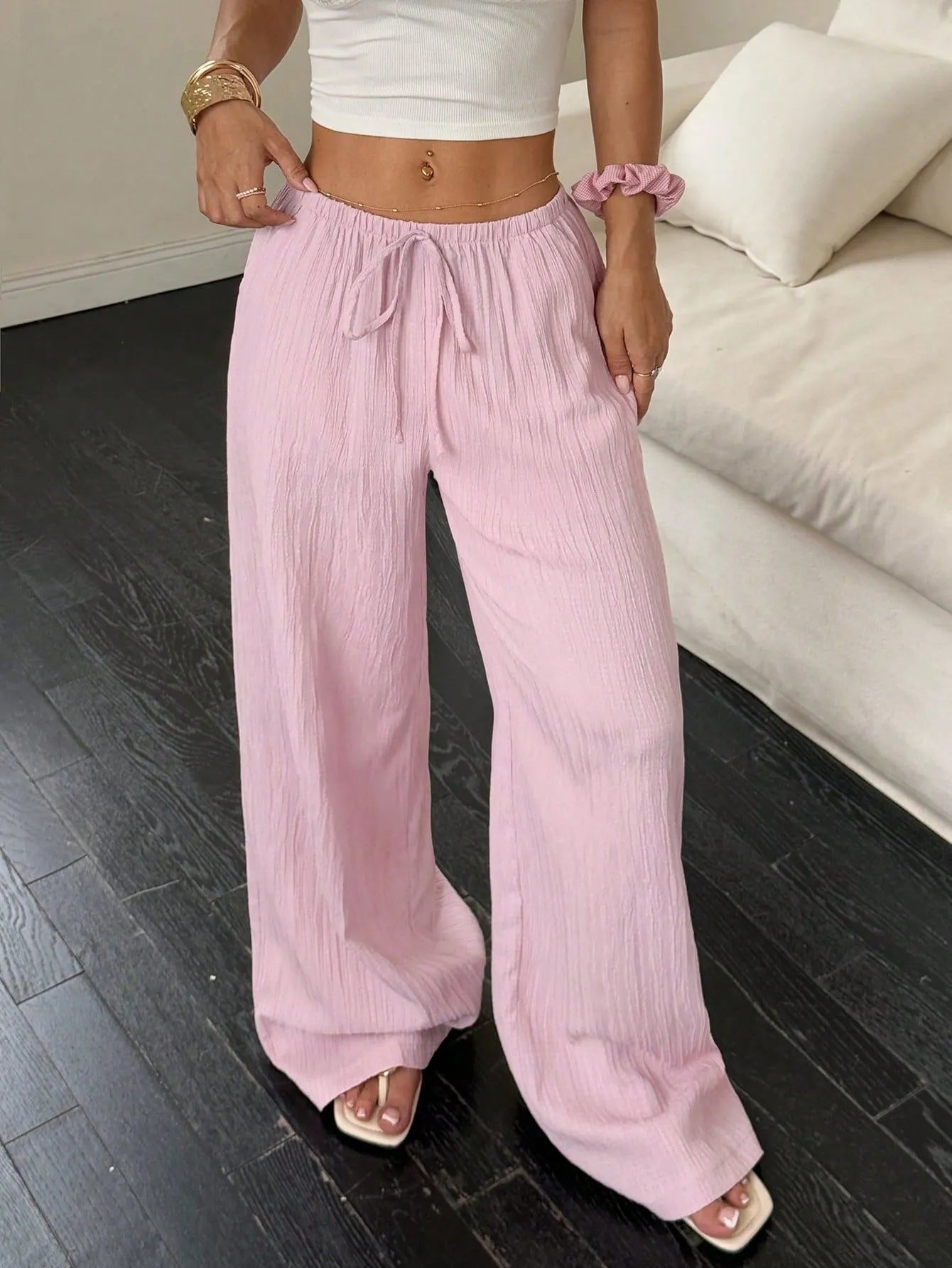 Women's black wide leg trousers with lace-up waist trimming on mid waist