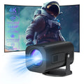 Black P330 portable mini projector with remote control on table displaying movie projection