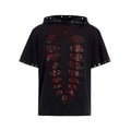 Black men's hooded short-sleeved t-shirt with sequin detailing, loose fit, shown in casual wear setting