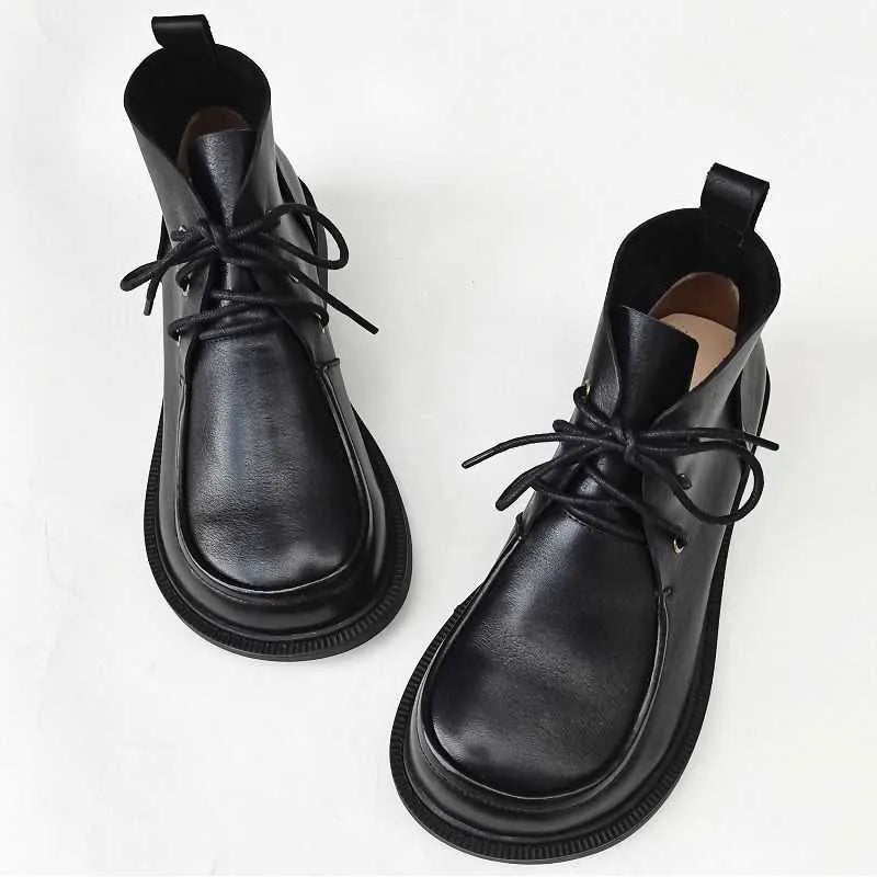Women's big toe ankle boots in black first layer cowhide leather with rubber sole and hollow-out detail