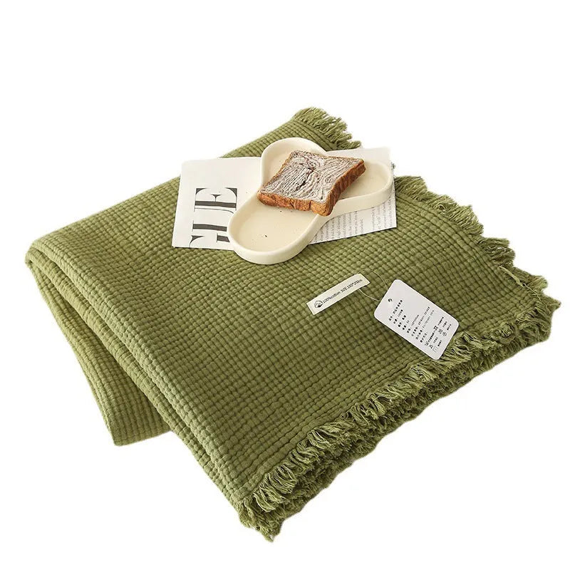 Four-layer gauze cotton blanket with tassel trim in avocado green colour
