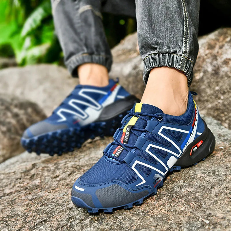 Men's grey and orange casual shoe with synthetic leather upper and non-slip rubber sole.