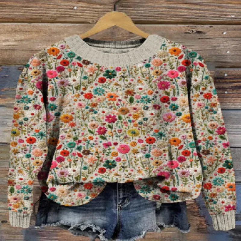 Women's round neck sweater with a digital floral print in a polyester fabric.