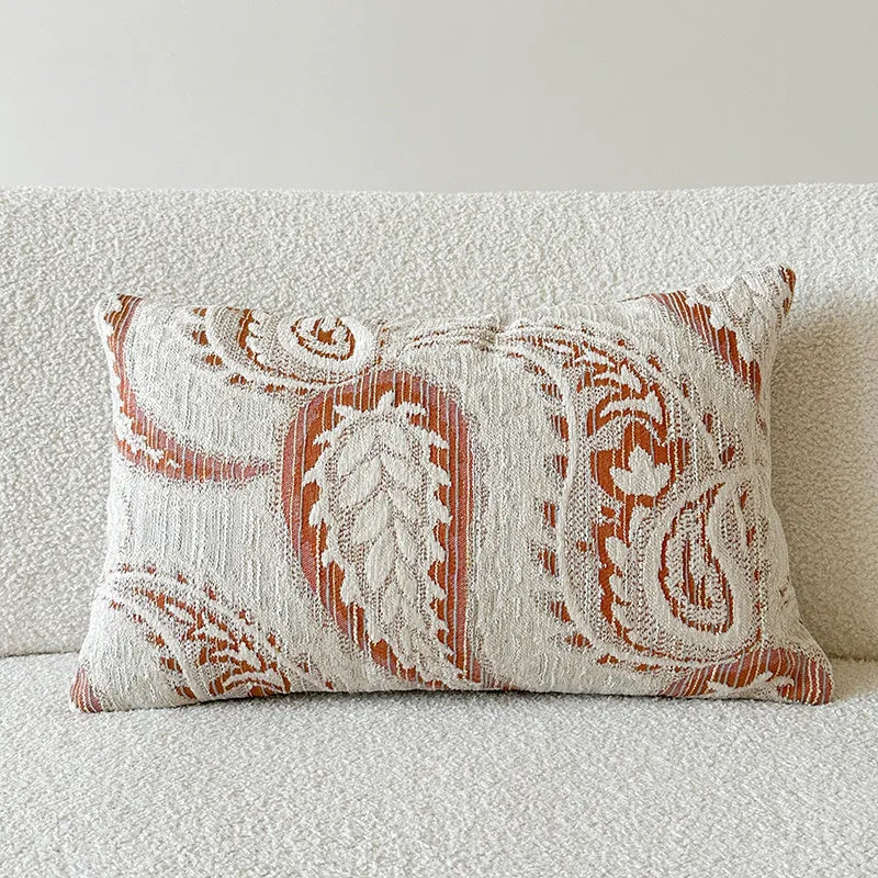 American-style paisley jacquard sofa backrest cushion in Amber colour on a grey sofa.