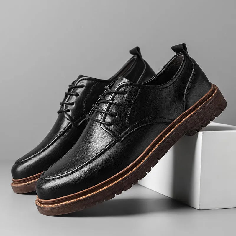 Men's brown leather casual shoes with round toe and flat rubber sole on a white background