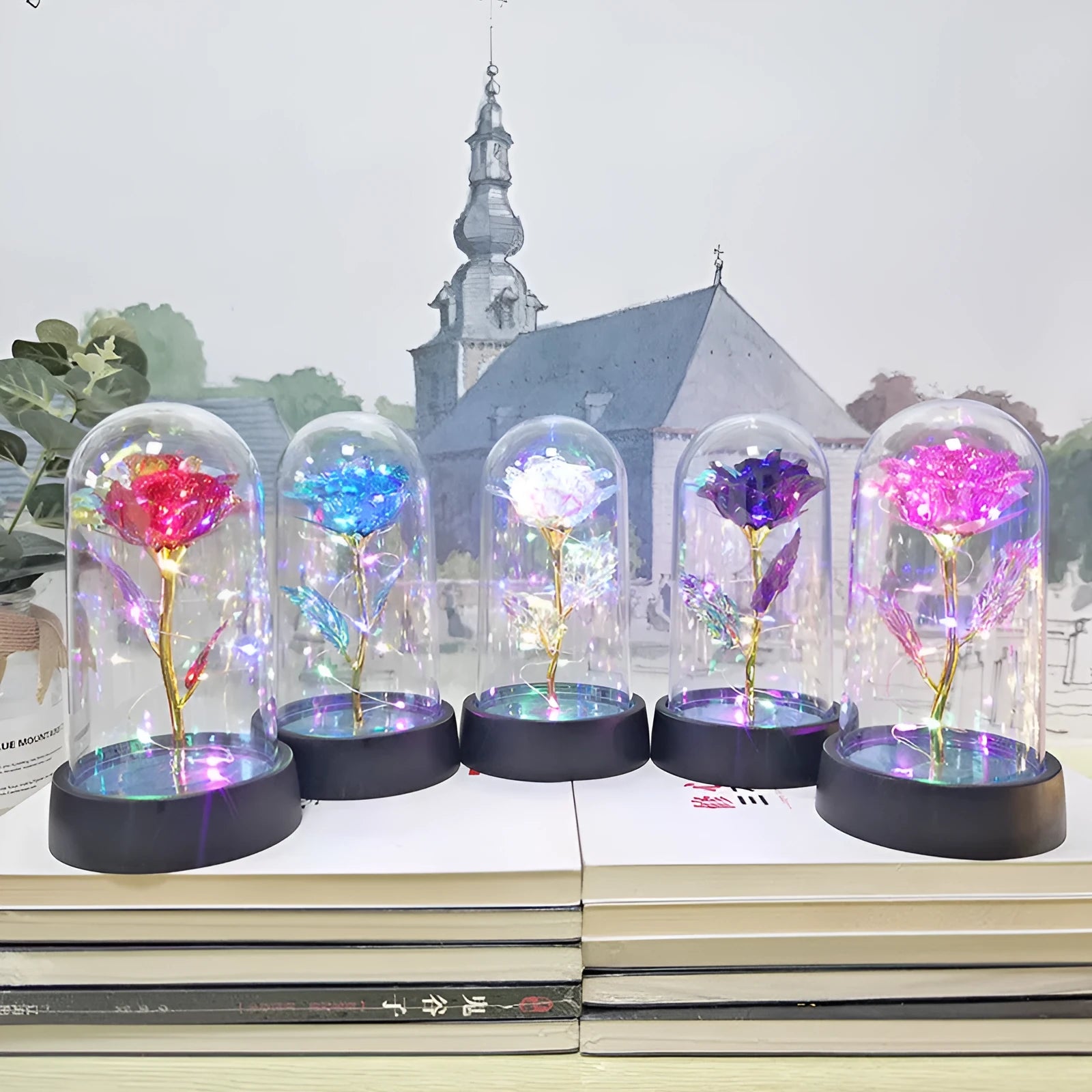 Small glass cover night lamp with plastic flower decoration showing warm golden light illumination